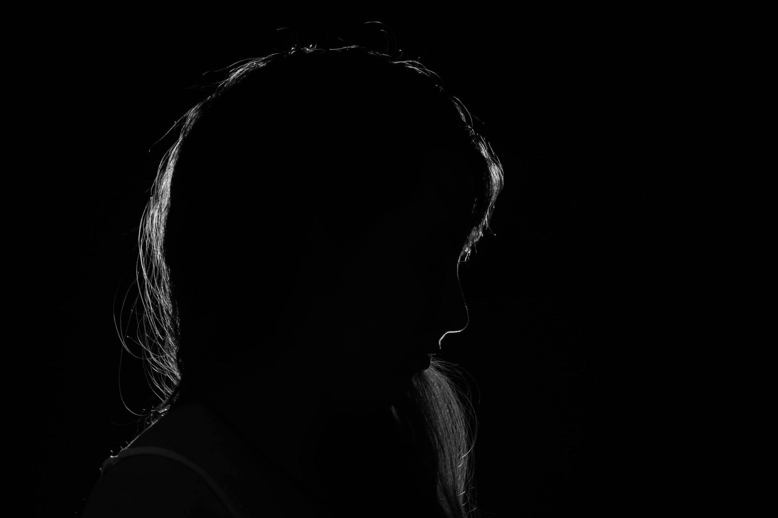 Woman in the dark to represent shame